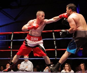 PORTLAND, ME - JUNE 20: Jason Quirk of Scarborough, left, lands a punch on Jesus Cintron of Massachusetts during their middleweight bout at the Portland Expo presented by the Portland Boxing Club on Saturday, June 20, 2015. (Photo by Gregory Rec/Staff Photographer)